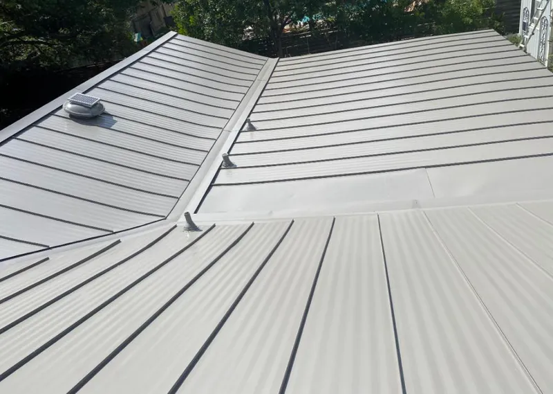 Solar attic fan installed on a metal roof for Roof Ventilation in Maumelle